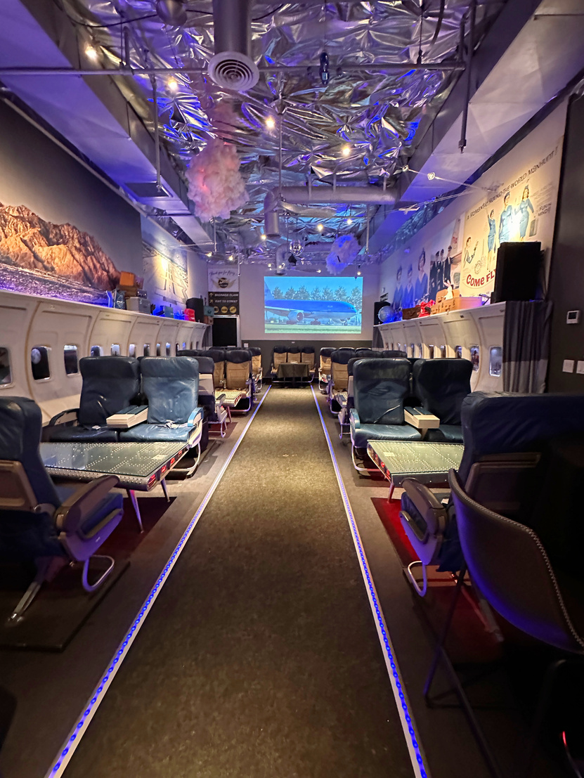 The interior of PS Air Bar in Palm Springs, which was built to look like the inside of an airplane.