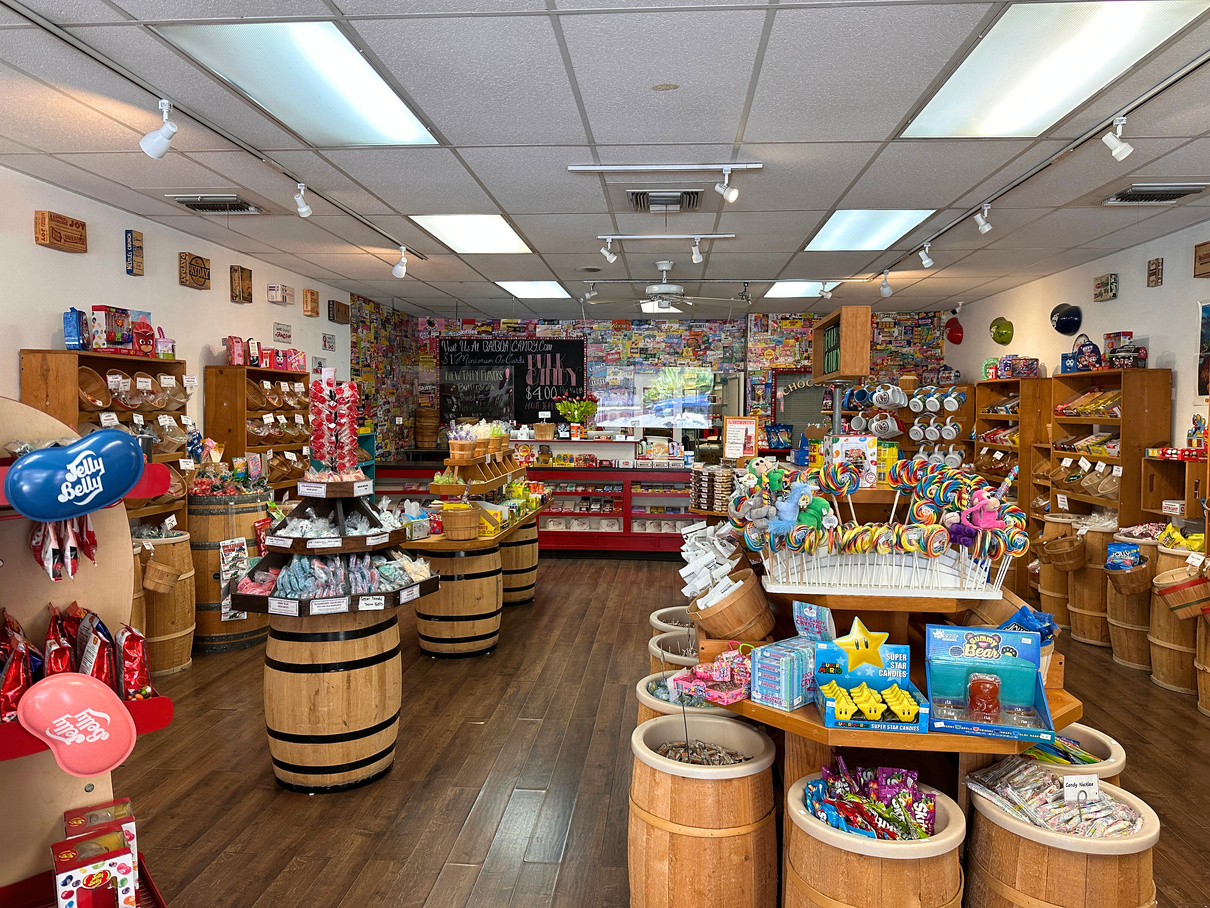 The interior of Balboa Candy in Palm Springs, showing barrels of all sorts of nostalgic candy and taffy.