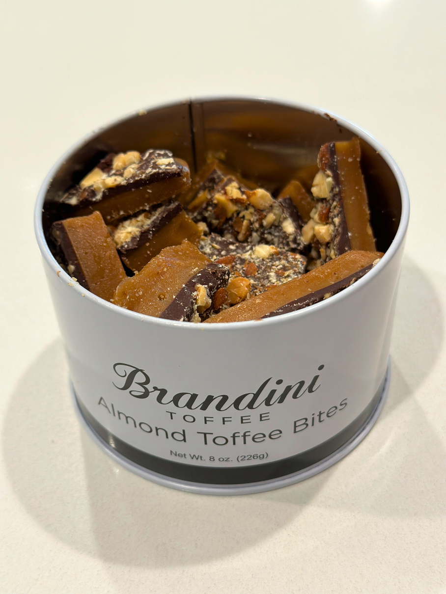A tin of Palm Springs' popular Brandini Toffee Almond Toffee Bites.