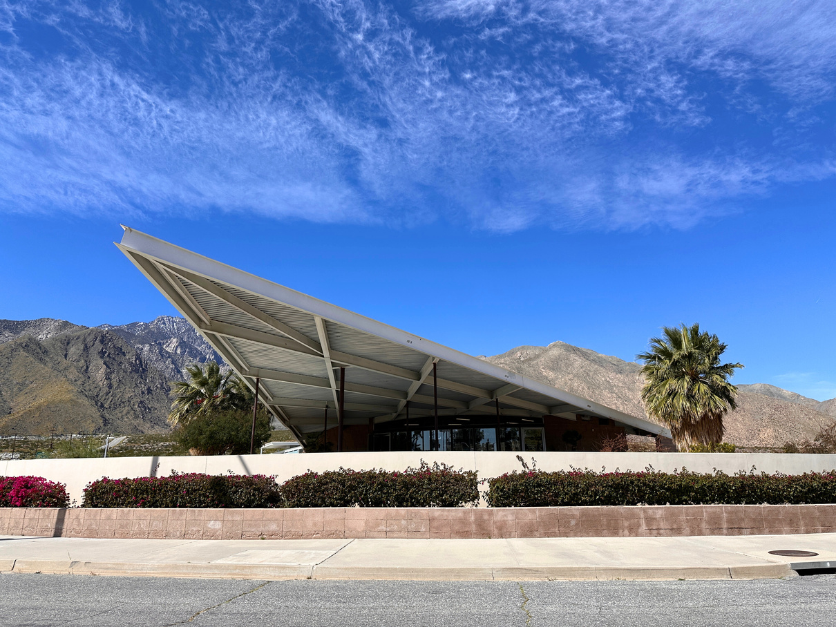 An exterior shot of the hyperbolic paraboloid roofline of the Palm Springs Visitors Center.