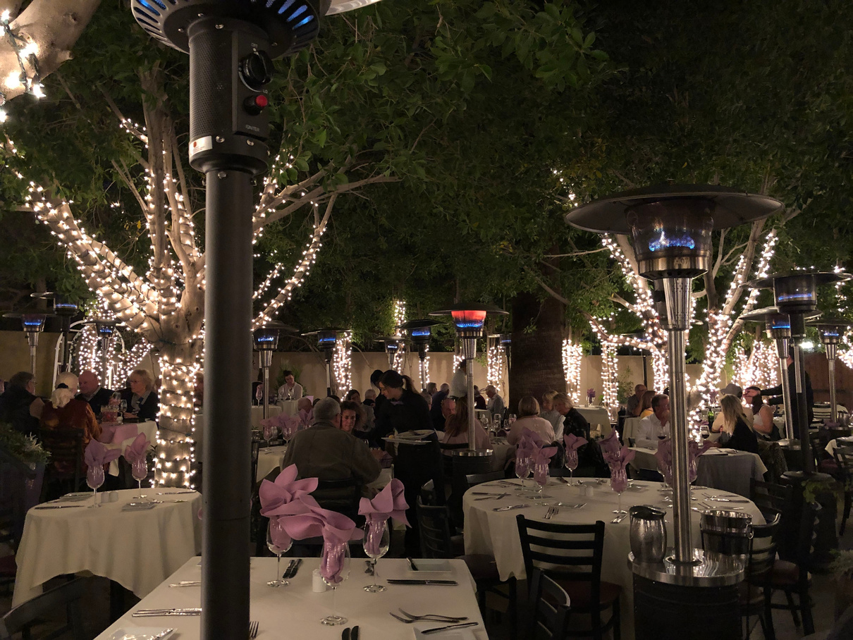The patio of Lavender Bistro in La Quinta, showing its many light-strung trees.