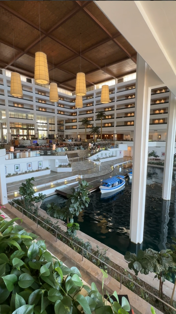 The interior of JW Marriott Desert Springs Resort & Spa in Palm Desert, showing the lobby/main bar area/lake with boats.