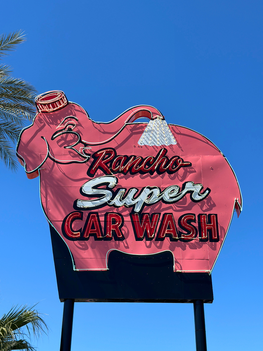 The historic pink elephant-shaped Rancho Super Car Wash neon sign in Rancho Mirage. 