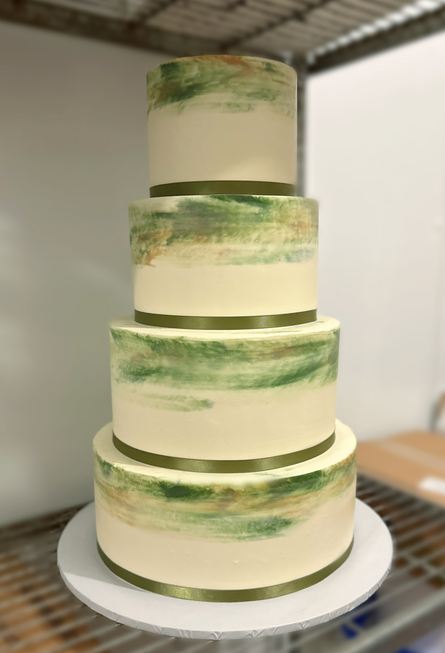 A custom green and cream-colored four-tier cake from Exquisite Desserts in Palm Desert.