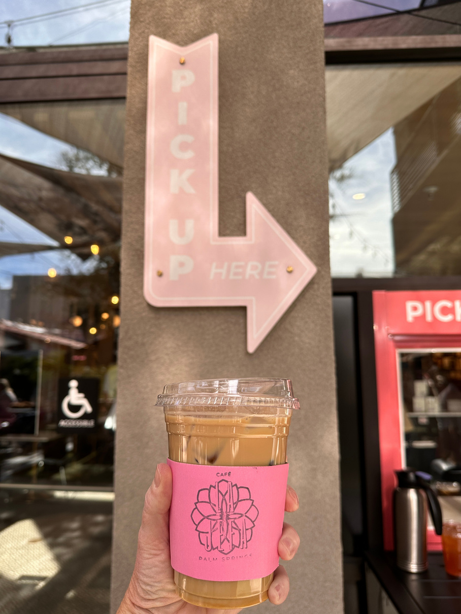 An iced latte positioned in front of the pick-up sign at Cafe La Jefa in Palm Springs.