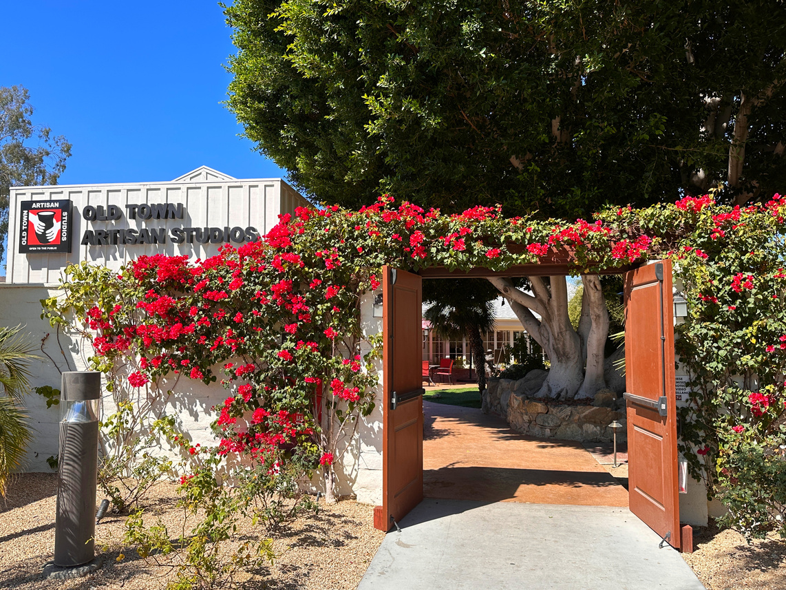 Bougainvillea-covered entrance to Old Town Artisan Studios in La Quinta.